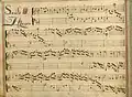 partition manuscrite rehaussée de couleurs, titre en lettres rouges et bleues