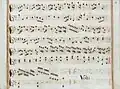 partition manuscrite rehaussée de couleurs passées rouge et bleu en bordures