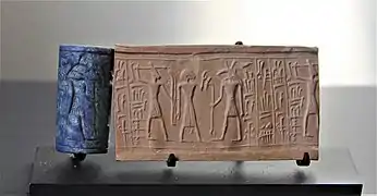 Sceau-cylindre du roi Addumu de Sidon, reprenant une iconographie d'inspiration égyptienne. XIIIe&nbsp;siècle&nbsp;av. J.-C., musée du Louvre.