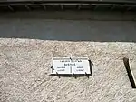 Plaque I.G.N no&nbsp;49 indiquant la distance en kilomètres des villages voisins