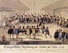 Dessin figurant une quarantaine hommes siégeant dans une formation en U, portant des capes noires, avec du texte indiquant "Eidgenössische Tagsatzung zu Baden, im Jahre 1531"