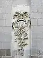 Motif sculpté de la cour intérieure évoquant la profession d'architecte