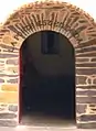 Porte avec inscription "LA PORTE EST EN DEDANS"