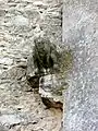 Vestige de gargouille et tête hurlante.