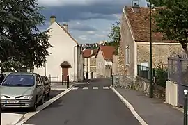 Même rue que l'image précédente à la fin du XXe&nbsp;siècle ; les bâtiments ont été détruits.