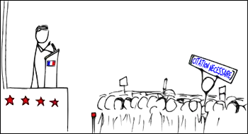 Dans une foule assistant à un discours politique, un individu brandit une pancarte mettant en doute l'assertion de l'homme politique et demandant une référence