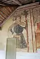 Peinture murale en façade ouest : saint Christophe (XVe&nbsp;siècle).